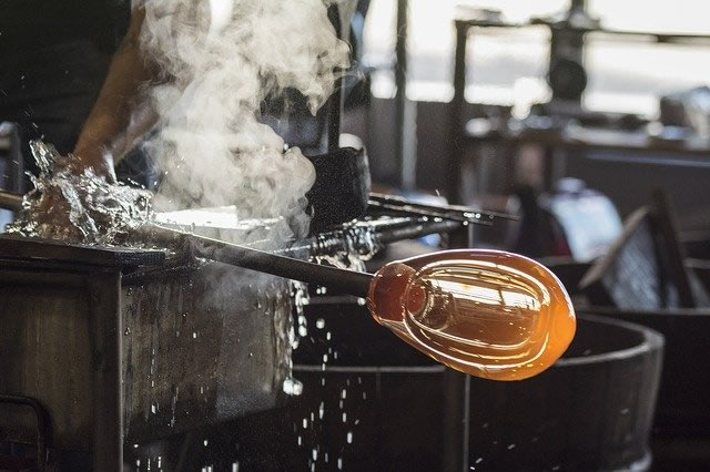 Picture of part of the process of blowing glass